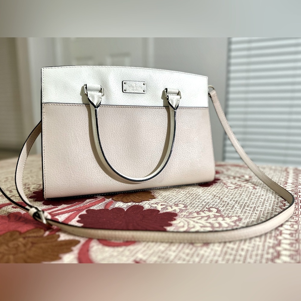 Leather Kate Spade purse with cross body strap.
